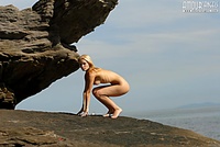 Nude girl and a rock Nude girl and a rock