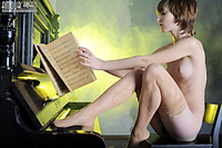 Naked girl on piano