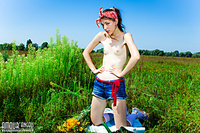 Tiny tit teen in field