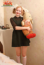 Innocent teen posing with teddy-bear