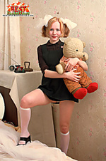 Innocent teen posing with teddy-bear