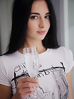 After a glass of sparkling champagne, benita takes off her t-shirt and spreads her legs wide open to flaunt her exquisite, unshaven pussy.