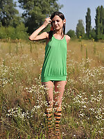 Marvelous teen girl in striped socks undressing and showing slender body on the nature. Amour Angels