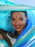 Indian teen goddess teasing with her absolutely perfect body while wearing a blue scarf and a summer dress.