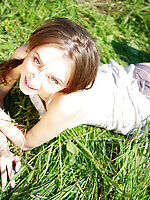 Green grass caresses nude teens most sensitive parts and makes her feel on cloud seven while posing.