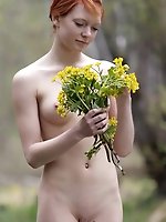 Beautiful flowers in the forest lure nude beauty teen as she starts pick them in fit of passion.