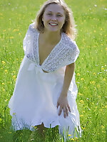 Teen masturbating on the grass