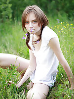 Timid teen girl comes to the nature and poses her beautiful body in front of the camera.