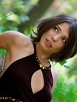 Hot girl takes off her dress while walking in the woods and shows off her tits and pussy.