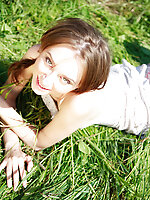 Green grass caresses nude teens most sensitive parts and makes her feel on cloud seven while posing.