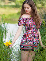 Entrancing teen takes off her dress by the river and exposes her perfectly shaped nude body. Amour Angels