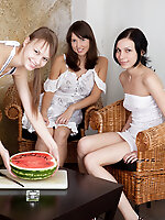 Three charming teen babes gathered together to eat some melon and get nude and naughty.