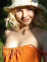 Blonde in a straw bonnet taking off her orange dress and stockings to walk around naked