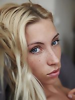 Cute freckles, playfully blonde tousled hair, soft skin and a lickable pussy..adele poses gracefully on a big comfy bed.