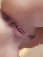 Bewitching beauty carie shows her neatly trimmed pussy