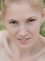 Adorable slender teen cutie taking off clothes and posing absolutely naked on the nature.