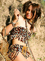 Gorgeous teen girl dressed up in exotic outfit shows off her sweet naked body outdoors.