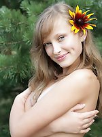 Which has the sunnier disposition... Nusia or her flower?