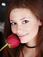 Redhead afrodita spreads her stocking-clad thighs