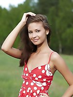 Afroditas gentle smile accentuates her elegant beauty as she sensually reveals her inviting and alluring body in an tempting manner.