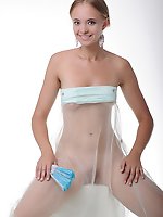 Rachel enjoys flaunting her fine luscious body with a white frilly shawl, especially her round, luscious breasts with puffy nipples, in a studio photo