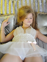 Innocent teenie in tempting white peignoir showing her wet pussy and tight ass on sofa. Innocent teenie in tempting white peignoir showing her wet pussy and tight ass on sofa.