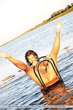 Unrestricted view of uma's wet and gleaming body on a desolate beach location. Unrestricted view of uma's wet and gleaming body on a desolate beach location.