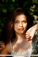 Charming, natural, and carefree beauty amidst lush vegetation.