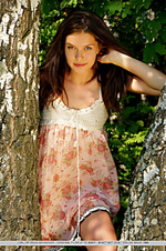 Charming, natural, and carefree beauty amidst lush vegetation.